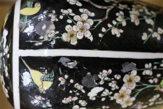 A pair of Chinese famille noire vases and covers height 26.5cm